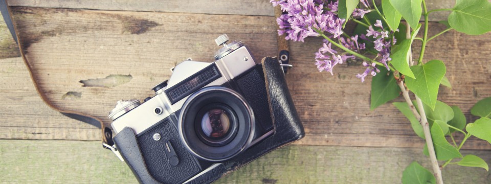 Lilac,And,Camera,On,Wooden,Table